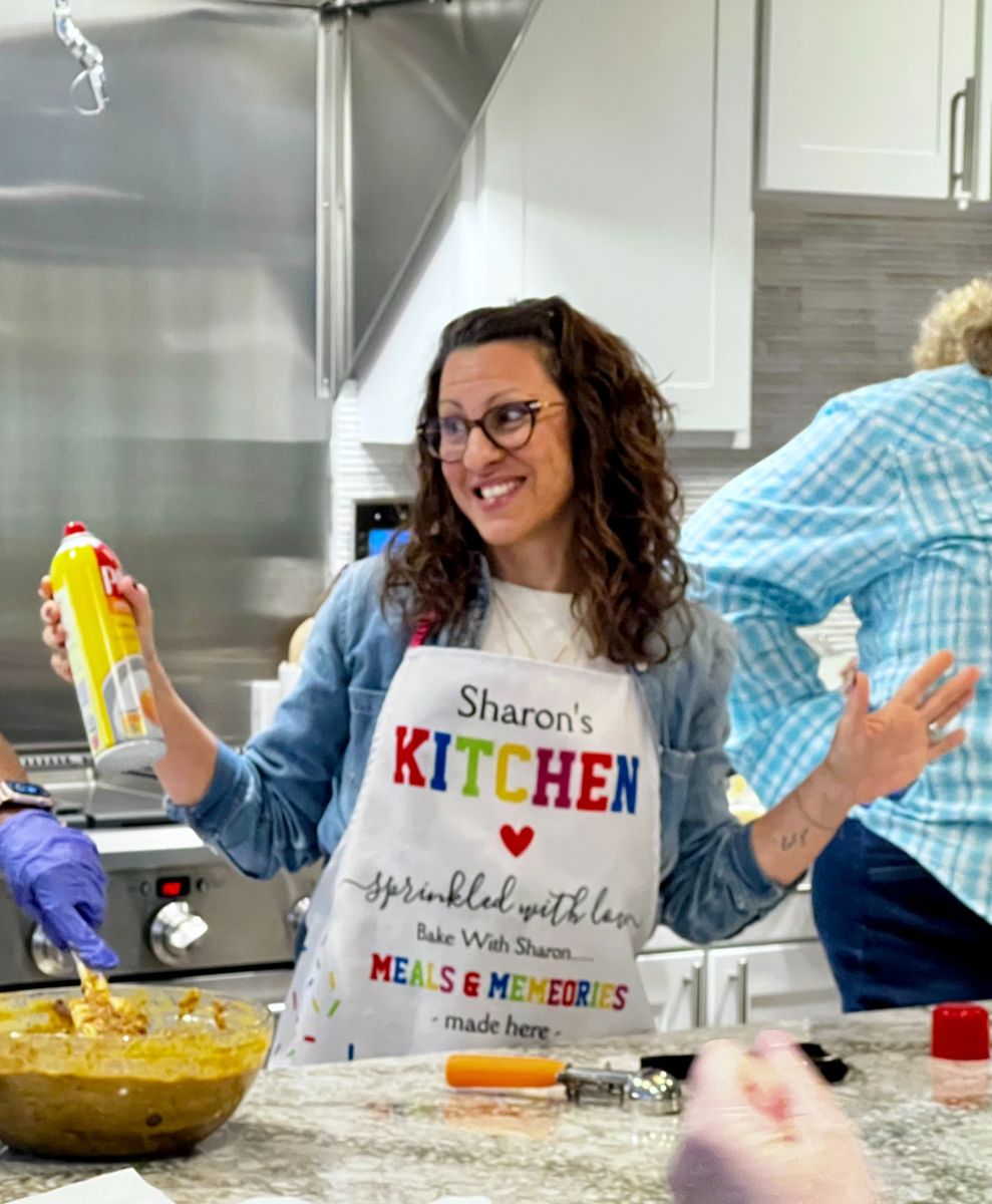 Photo of Sharon baking and smiling